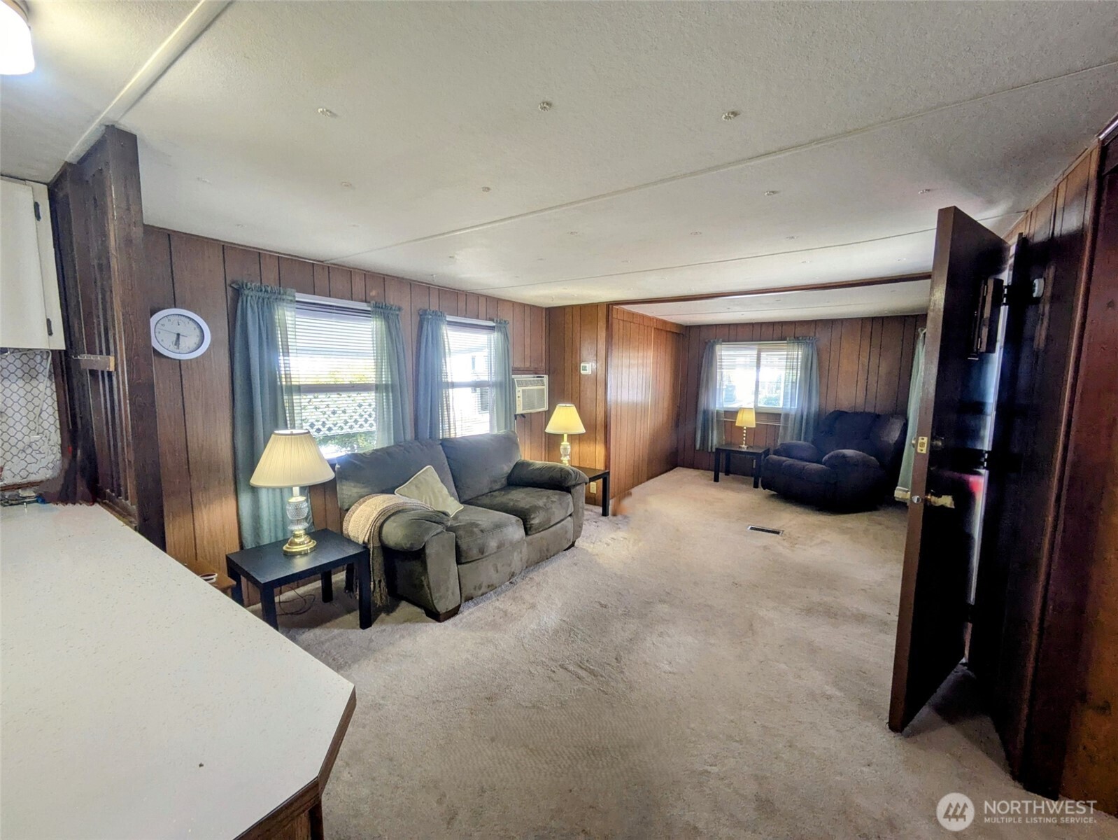 2302 R Street Southeast, Unit 108 Auburn, WA 98002 - Photo 13 of 23 a living room with furniture and a lamp