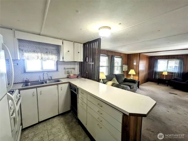 a bedroom with a large bed and a dresser