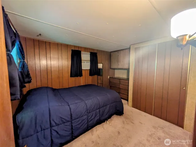 a bedroom with a bed and a closet