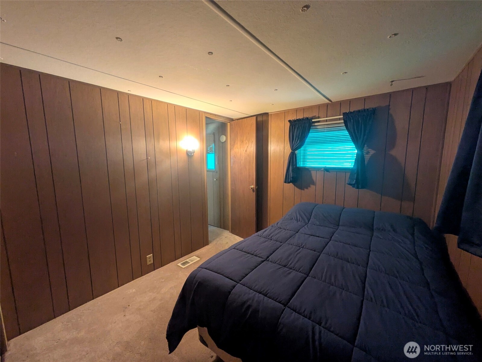 2302 R Street Southeast, Unit 108 Auburn, WA 98002 - Photo 17 of 23 a bedroom with a bed and a closet