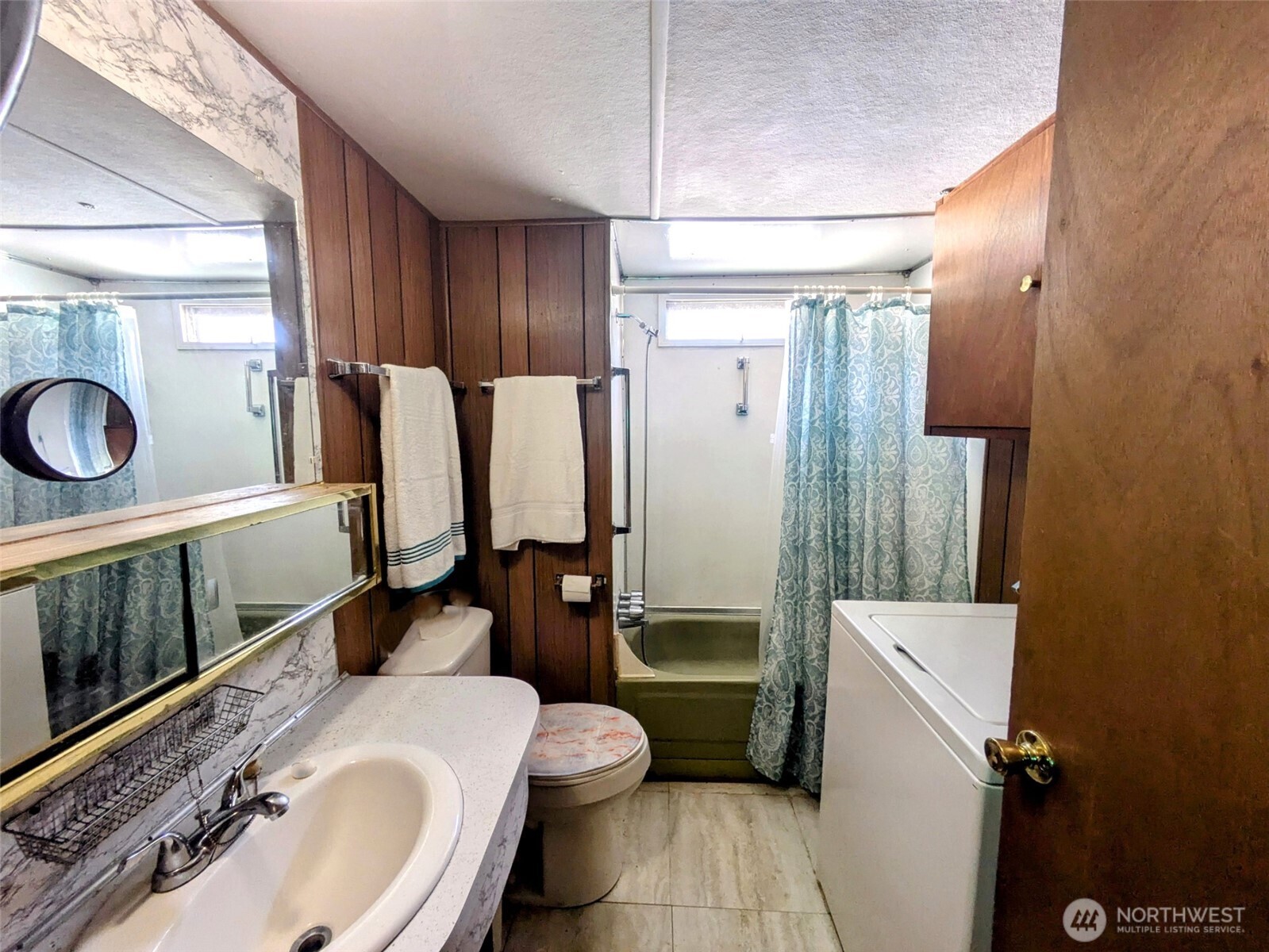2302 R Street Southeast, Unit 108 Auburn, WA 98002 - Photo 18 of 23 a bathroom with a sink toilet and shower