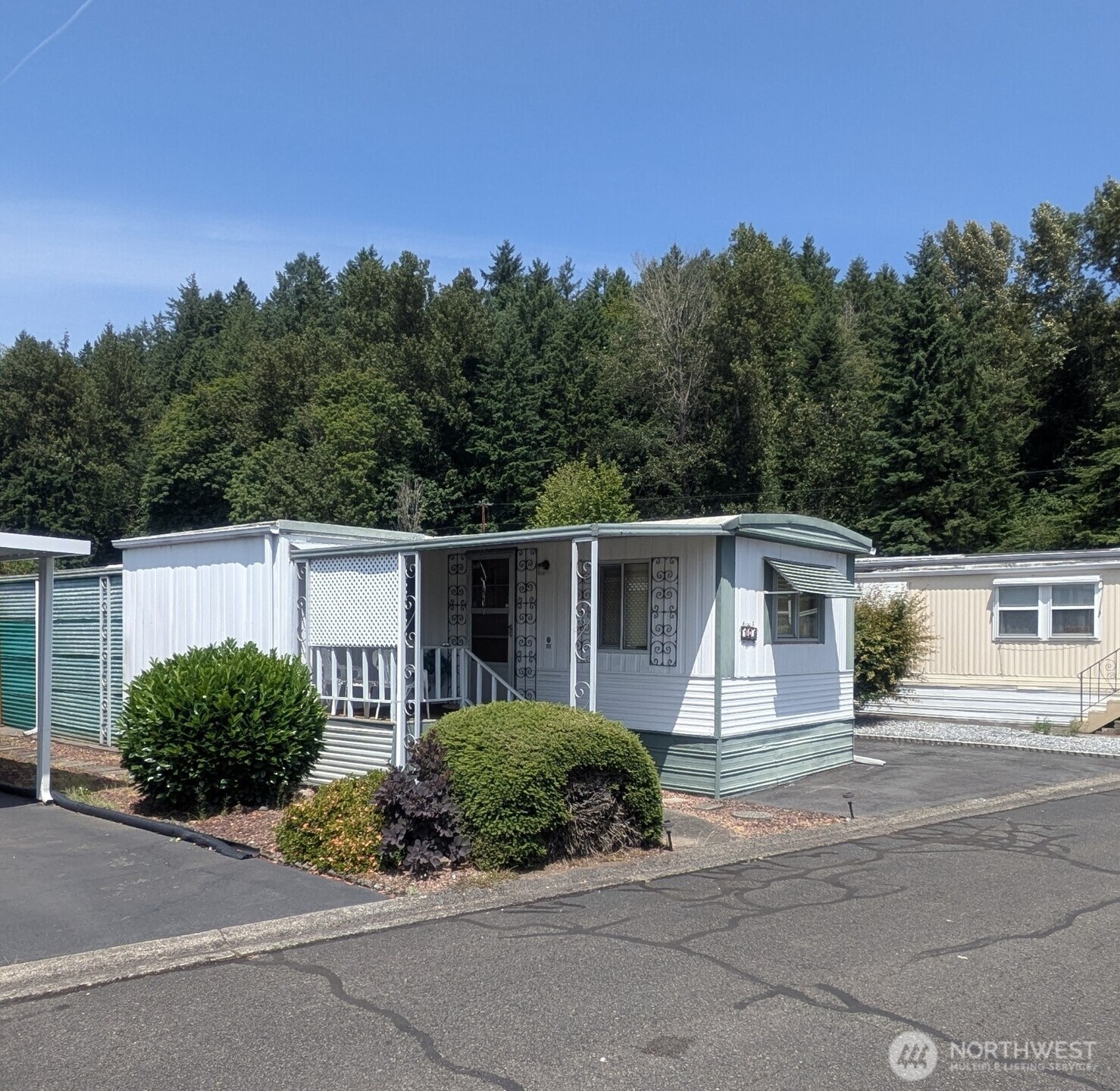 2302 R Street Southeast, Unit 108 Auburn, WA 98002 - Photo 2 of 23 front view of a house with a yard