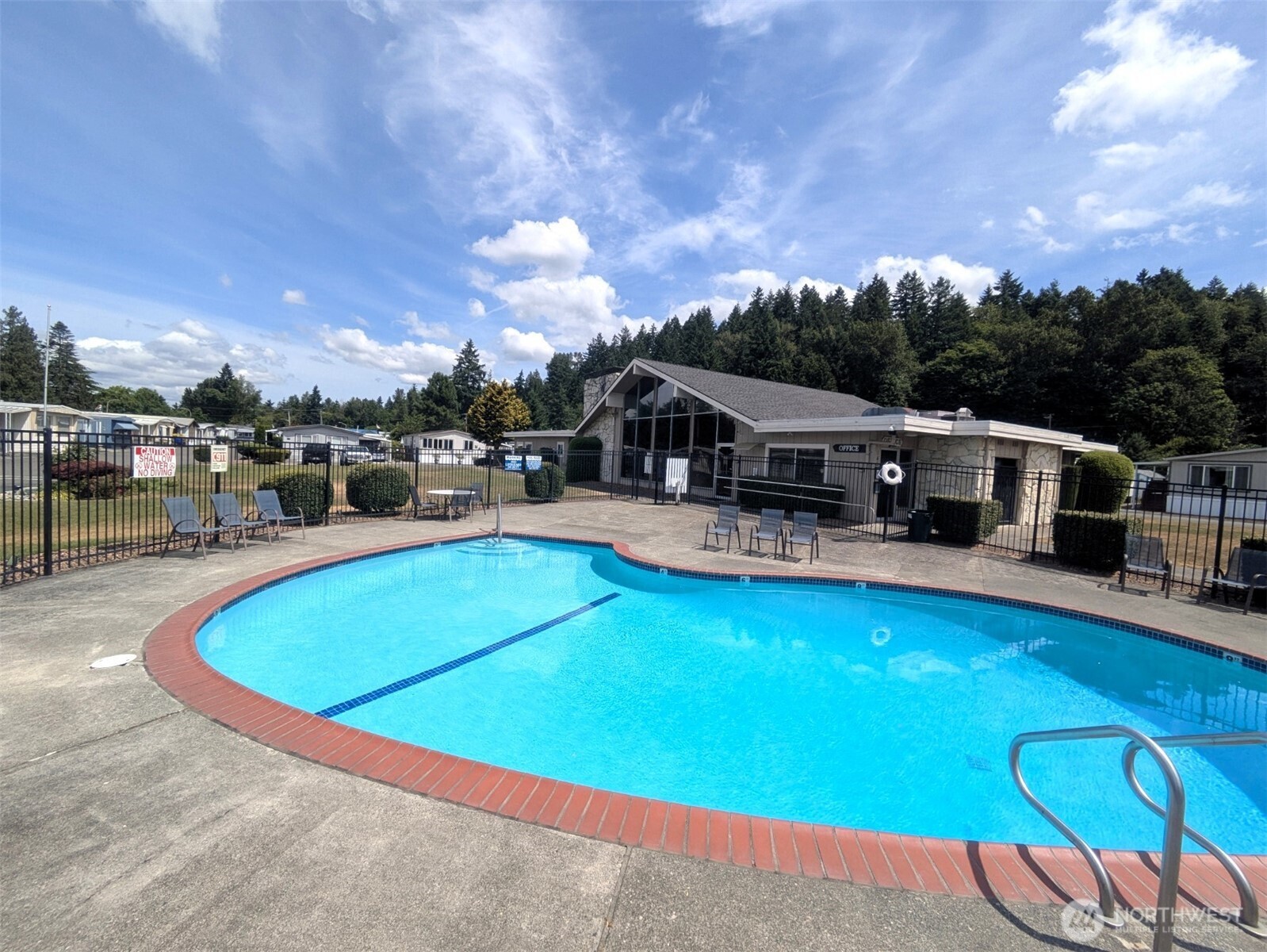 2302 R Street Southeast, Unit 108 Auburn, WA 98002 - Photo 21 of 23 an outdoor space with swimming pool and furniture