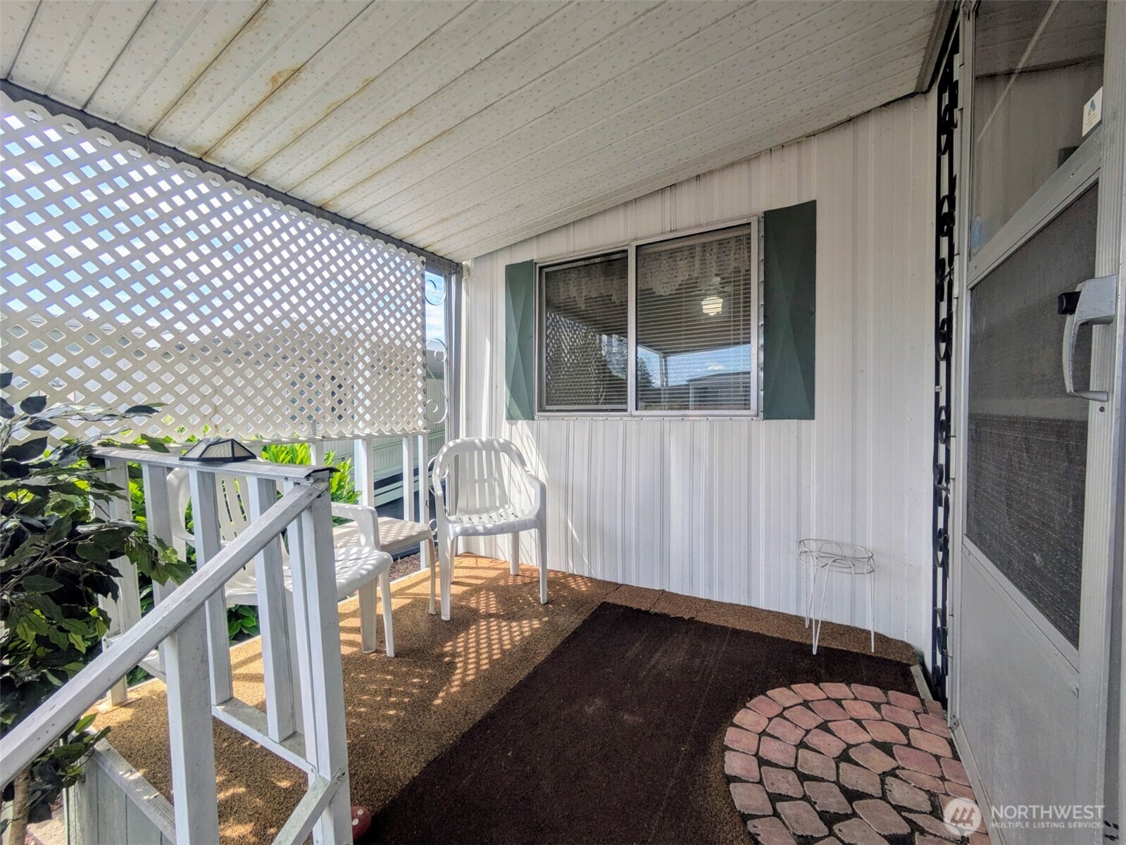 2302 R Street Southeast, Unit 108 Auburn, WA 98002 - Photo 3 of 23 a balcony view with a potted plant in front of it