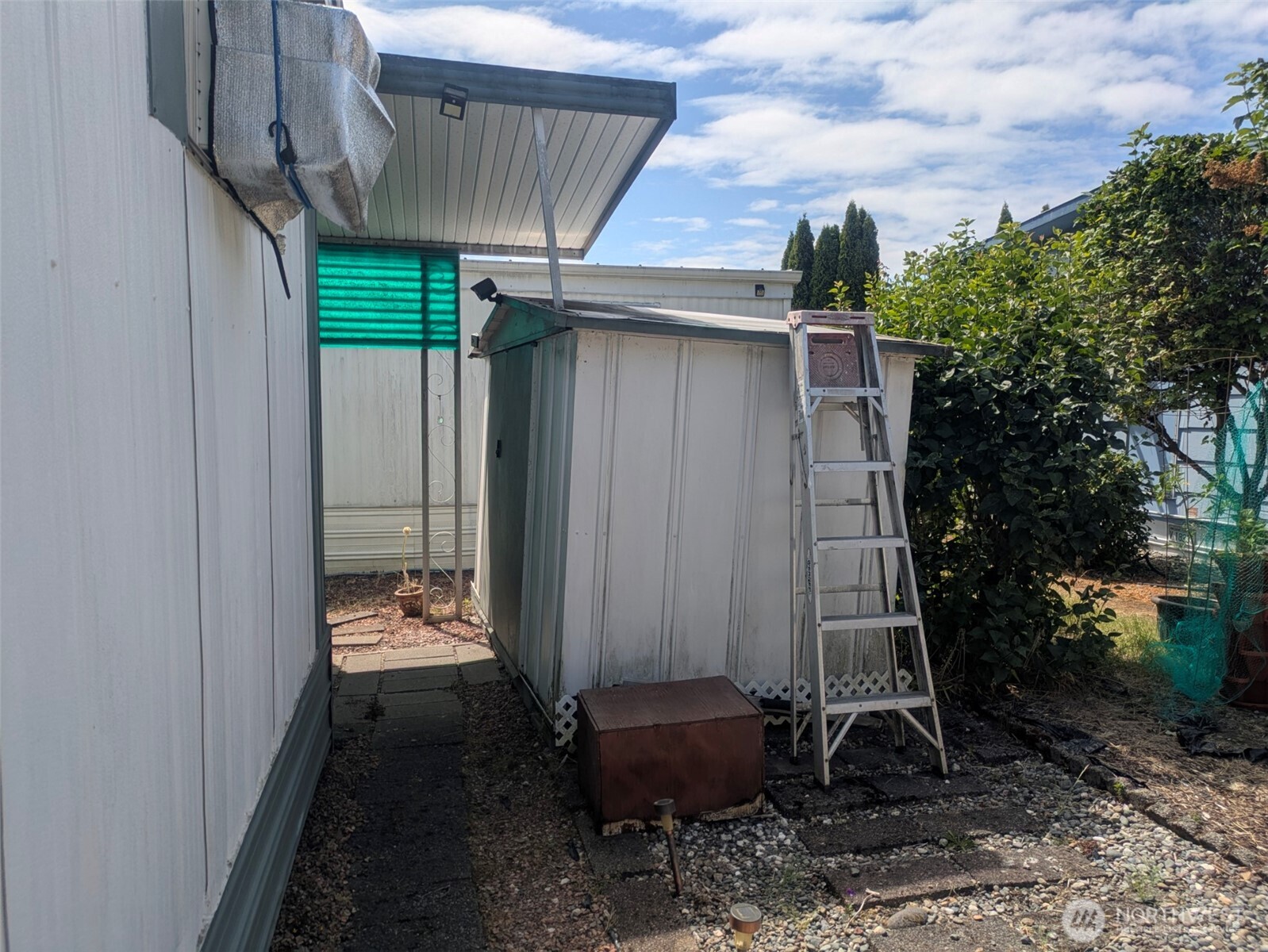 2302 R Street Southeast, Unit 108 Auburn, WA 98002 - Photo 5 of 23 a view of a back yard of the house