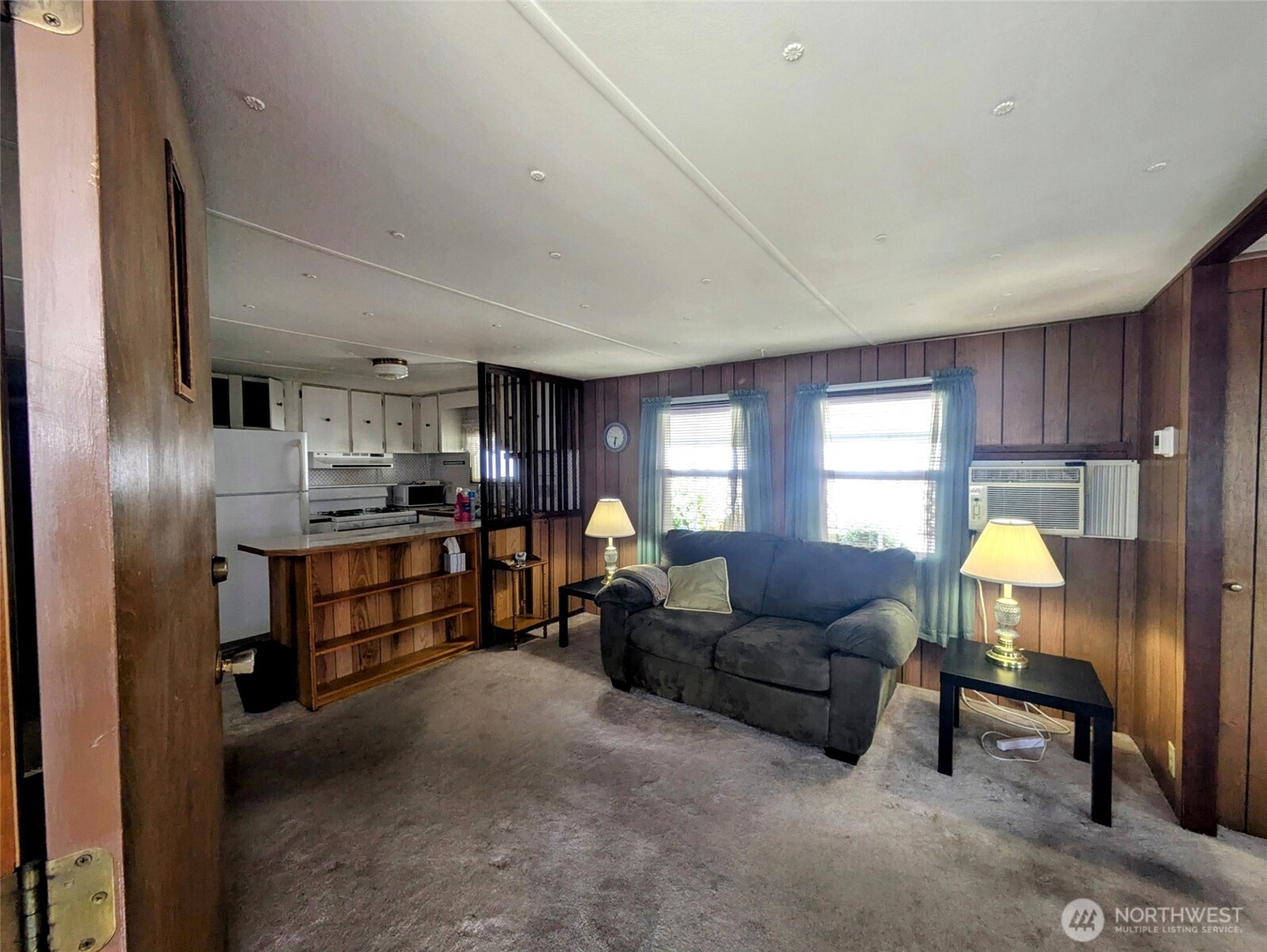 2302 R Street Southeast, Unit 108 Auburn, WA 98002 - Photo 6 of 23 a living room with furniture and a chandelier