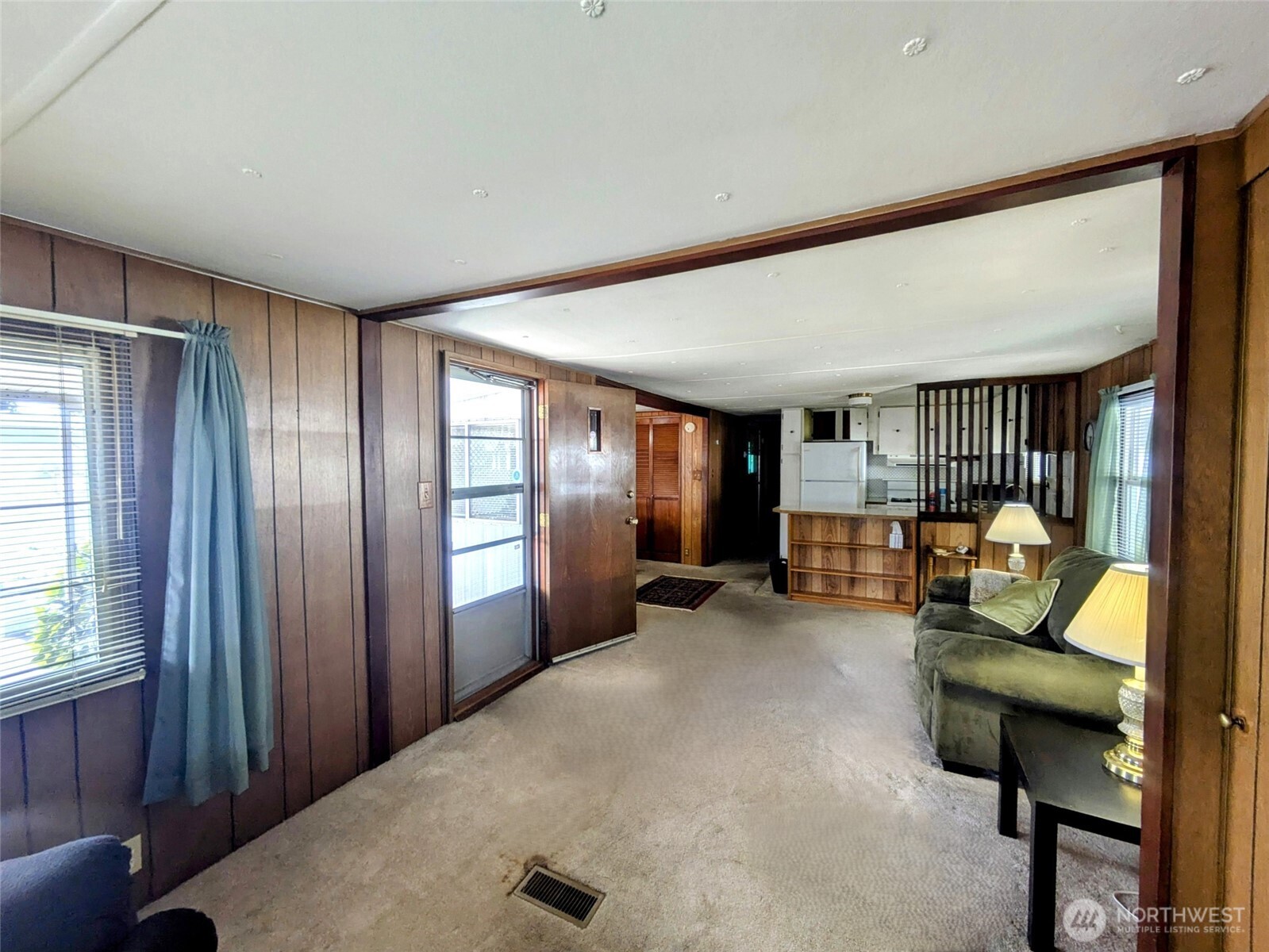 2302 R Street Southeast, Unit 108 Auburn, WA 98002 - Photo 7 of 23 a living room with furniture and a large window