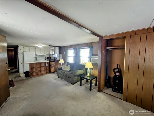 a living room with furniture a table and chairs