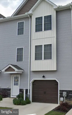 a front view of a house with garage