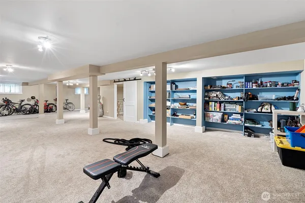 a room with furniture and gym equipment