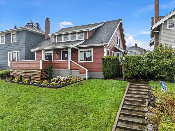 a front view of house with yard and green space
