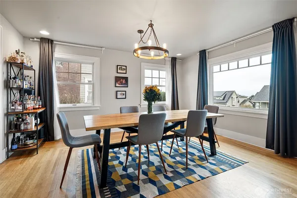 a view of a dining room with furniture window and wooden floor