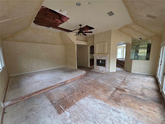 a view of backyard with mountain view and trees