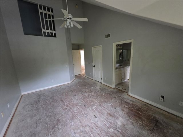 a view of a hallway with a bathroom
