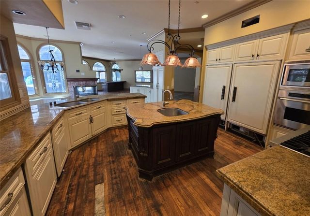 a room with wooden floors and furniture