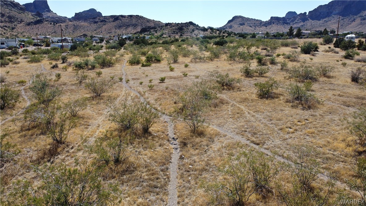 1885 Greer Road Golden Valley, AZ 86413 - Photo 13 of 16 a view of a lake with mountains in the background
