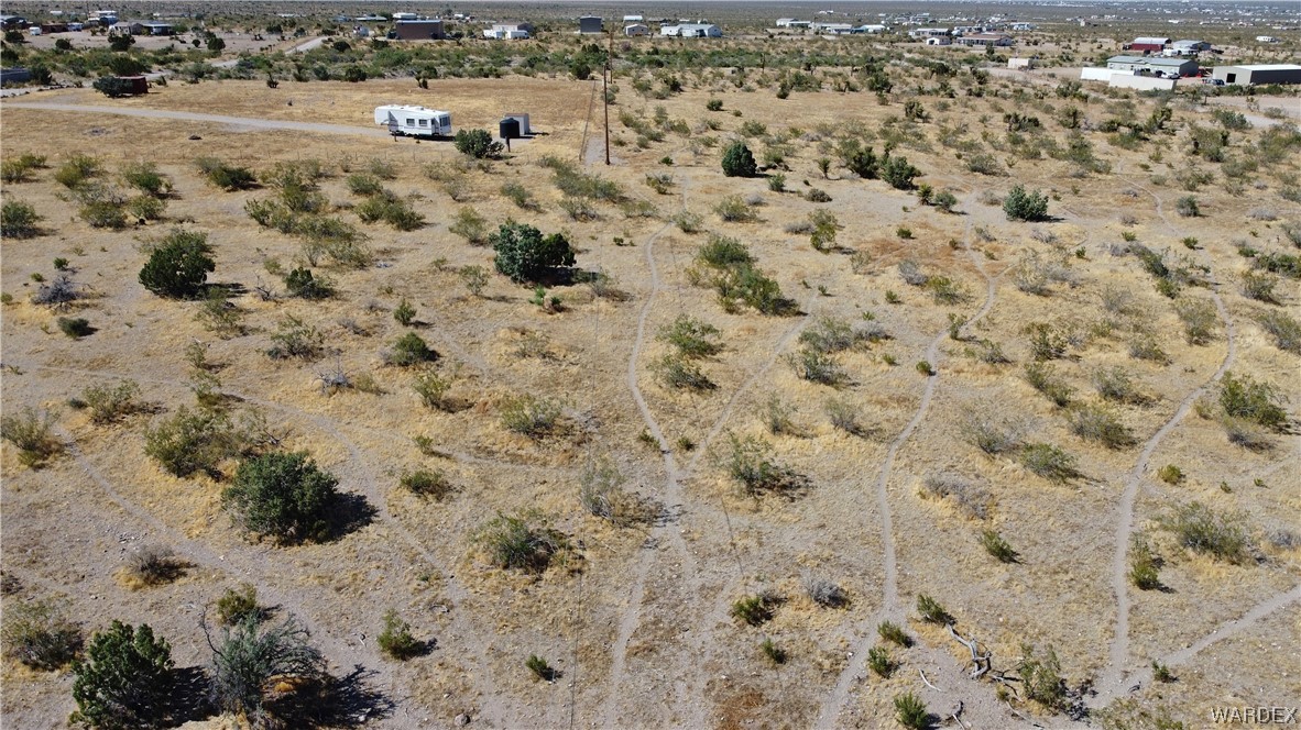 1885 Greer Road Golden Valley, AZ 86413 - Photo 4 of 16 a view of a dry yard covered with snow