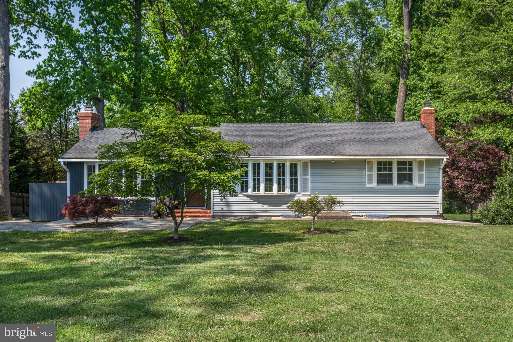 a house view with a sitting space and garden