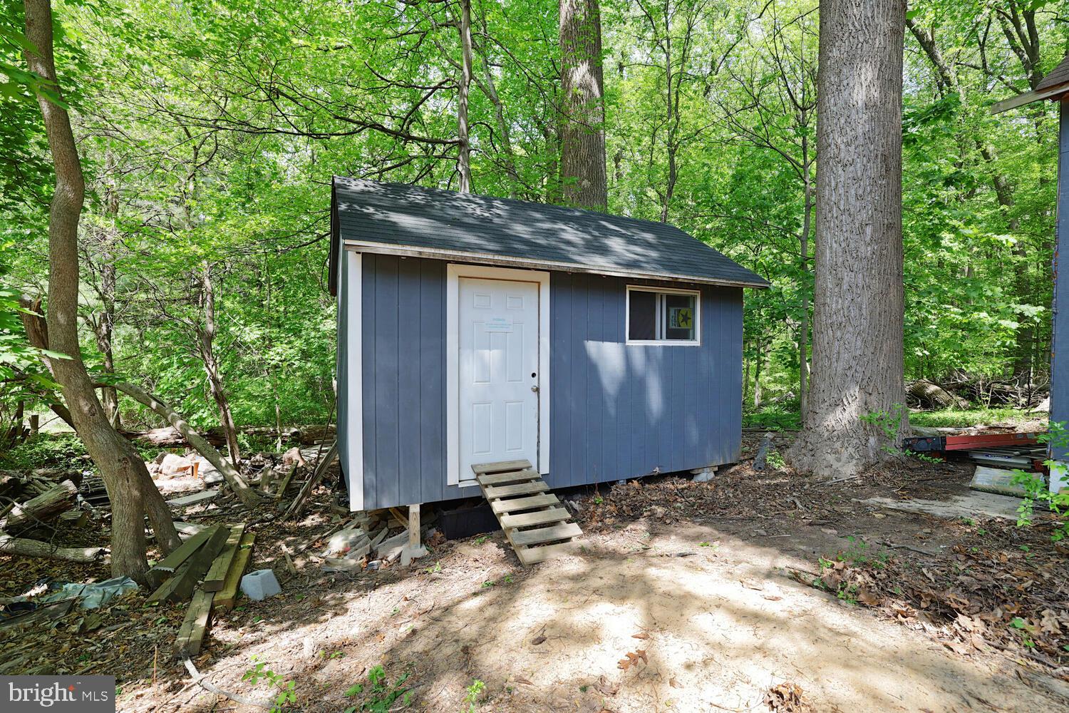 1204 Ednor Road Silver Spring, MD 20905 - Photo 22 of 27 a view of a barn in the middle of a yard