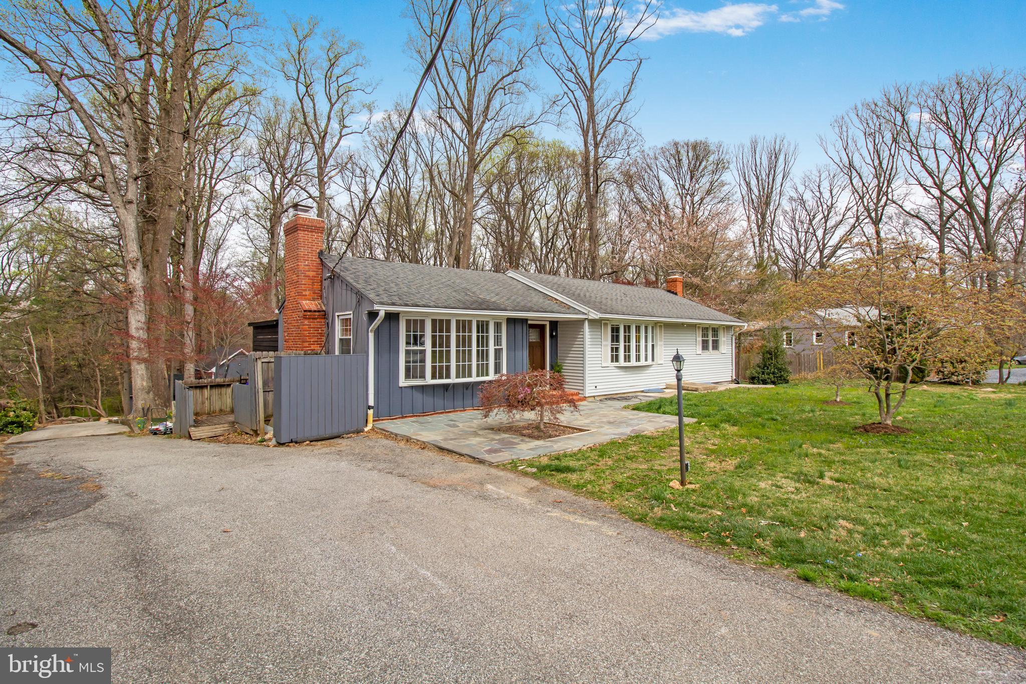 1204 Ednor Road Silver Spring, MD 20905 - Photo 24 of 27 a front view of house with yard and trees in the background