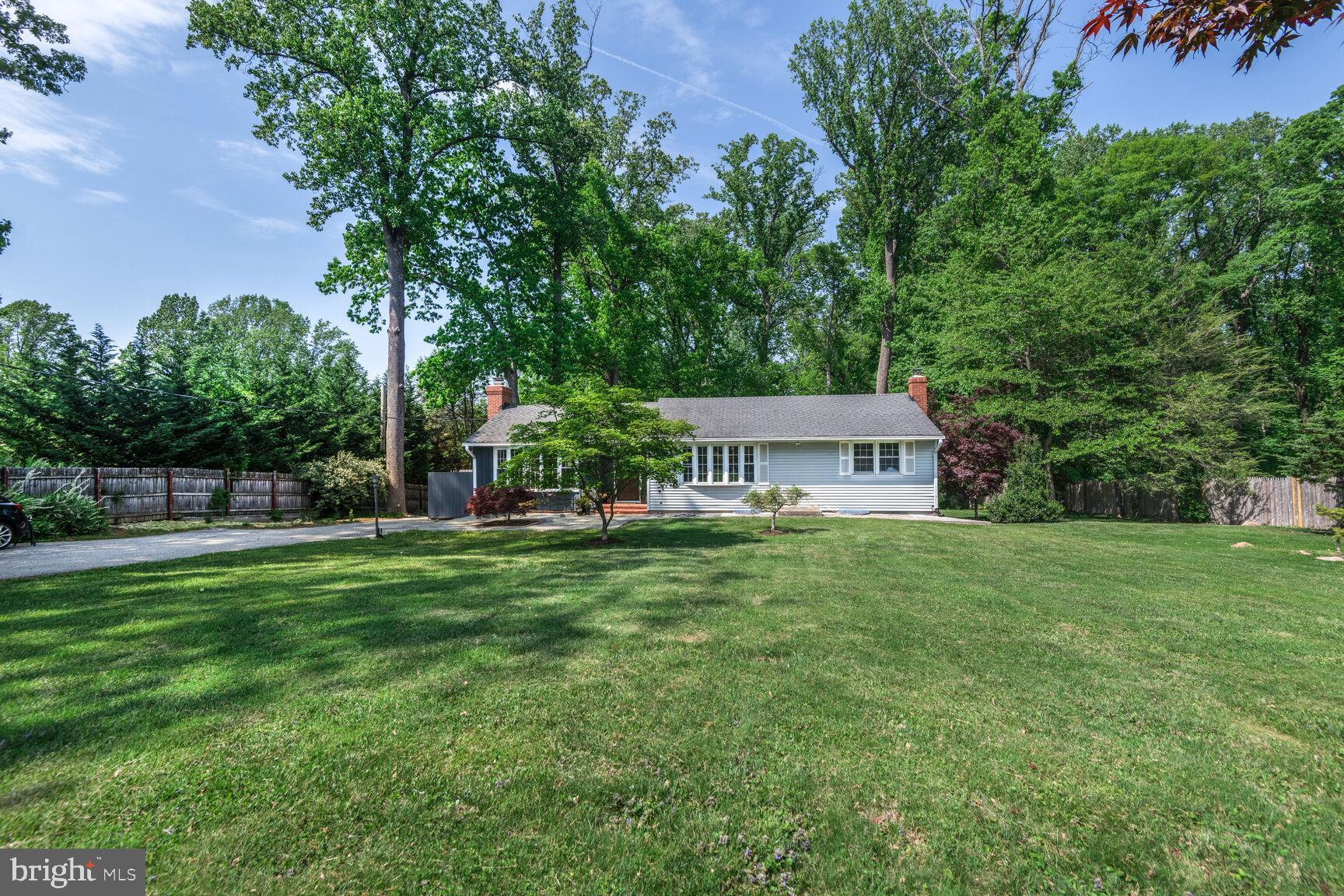 1204 Ednor Road Silver Spring, MD 20905 - Photo 27 of 27 a view of a house with a big yard and large trees