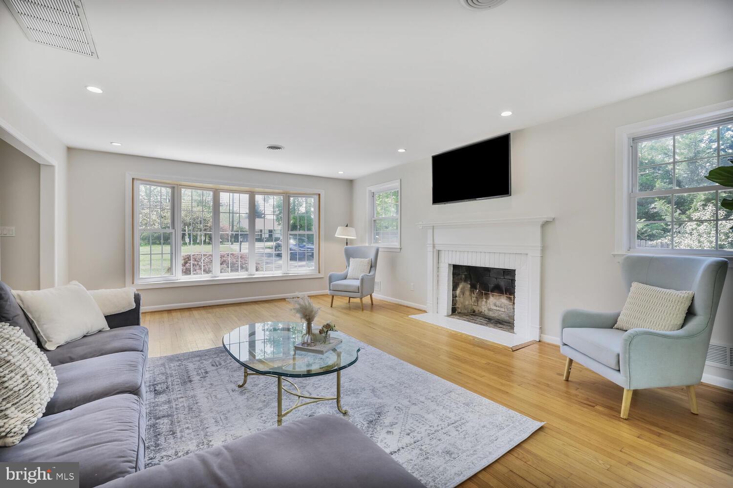 1204 Ednor Road Silver Spring, MD 20905 - Photo 4 of 27 a living room with furniture and a fireplace