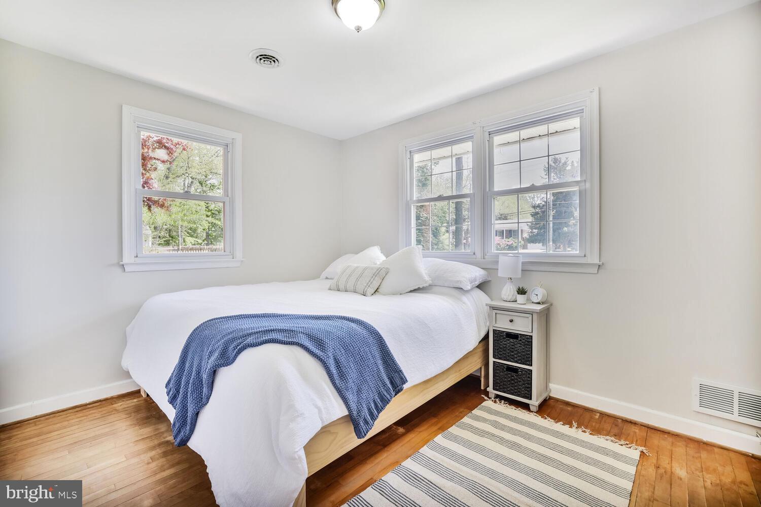 1204 Ednor Road Silver Spring, MD 20905 - Photo 9 of 27 a bedroom with a bed and a window