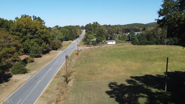 a view of mountain with a field