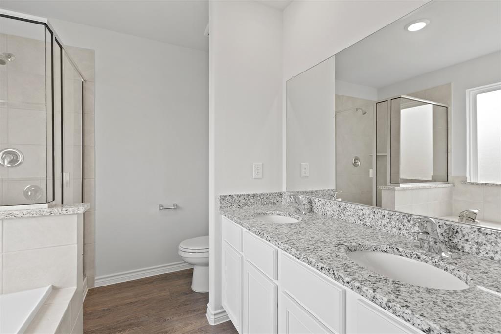 1603 Romans Road Ennis, TX 75119 - Photo 12 of 21 a bathroom with a granite countertop sink and a mirror