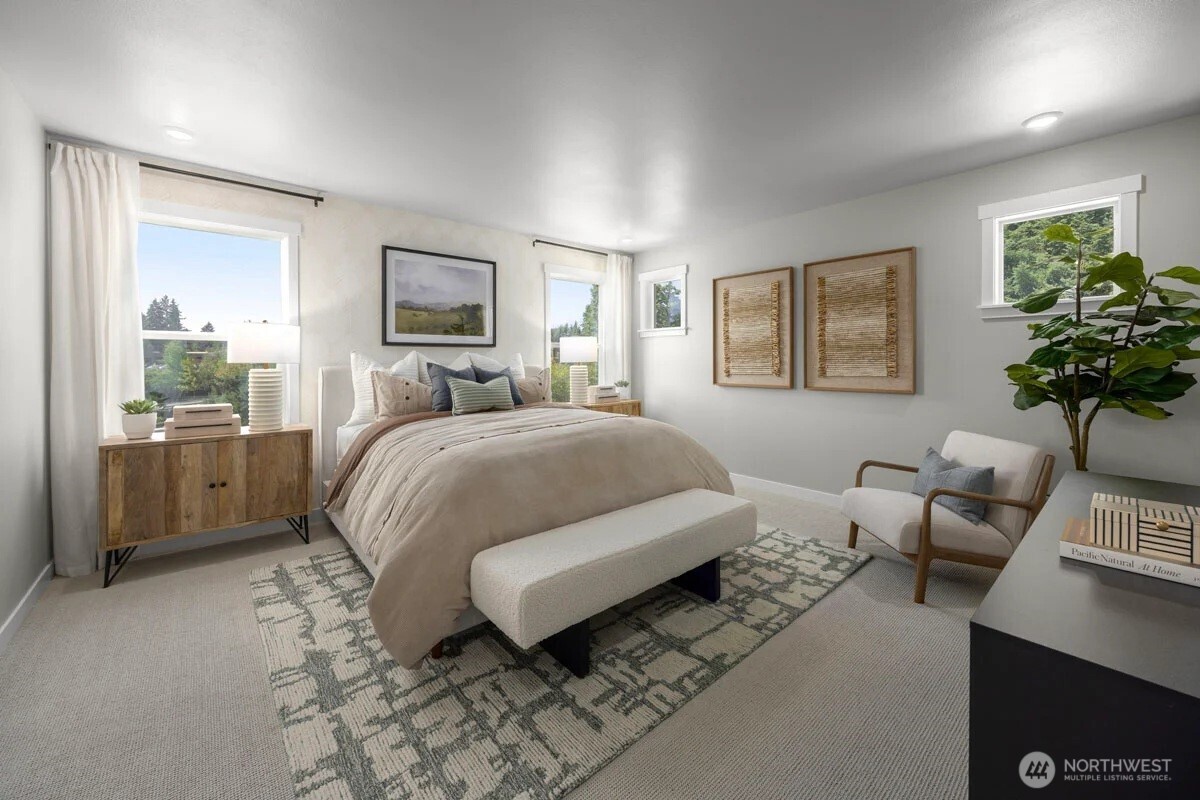 24322 13 Avenue Southeast, Unit CR11 Bothell, WA 98021 - Photo 4 of 7 a bedroom with a bed a couch and potted plant with the wooden floor