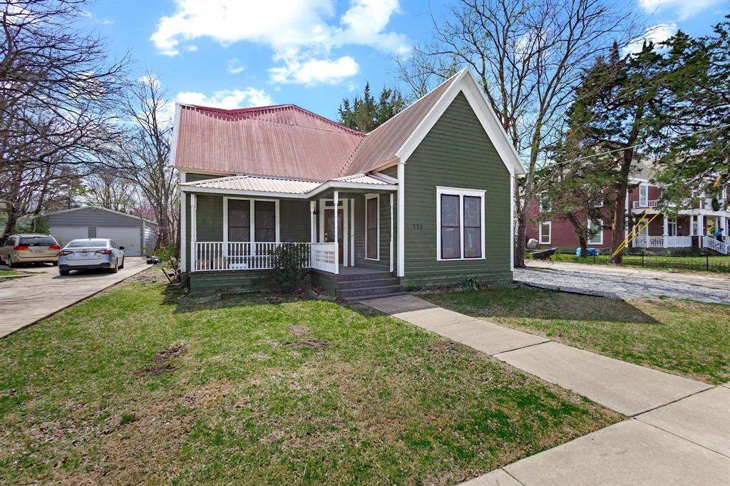 331 West Grand Street Whitewright, TX 75491 - Photo 1 of 39 a front view of a house with a yard