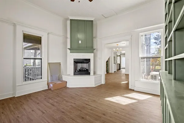 a view of livingroom with hardwood floor and a fireplace