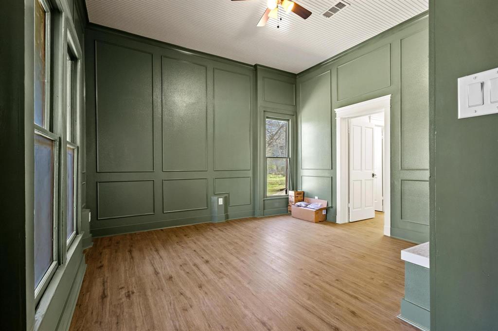 331 West Grand Street Whitewright, TX 75491 - Photo 19 of 39 a view of a livingroom with wooden floor