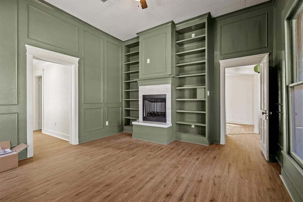 331 West Grand Street Whitewright, TX 75491 - Photo 20 of 39 a view of an empty room with a closet and wooden floor