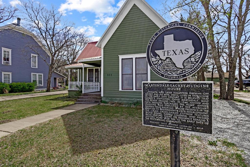 331 West Grand Street Whitewright, TX 75491 - Photo 2 of 39 a sign on the side of a building