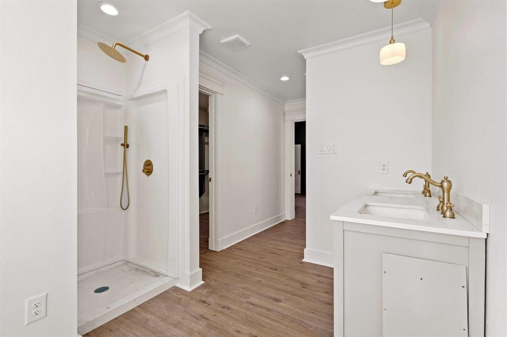 331 West Grand Street Whitewright, TX 75491 - Photo 24 of 39 a bathroom with a sink a shower and a mirror