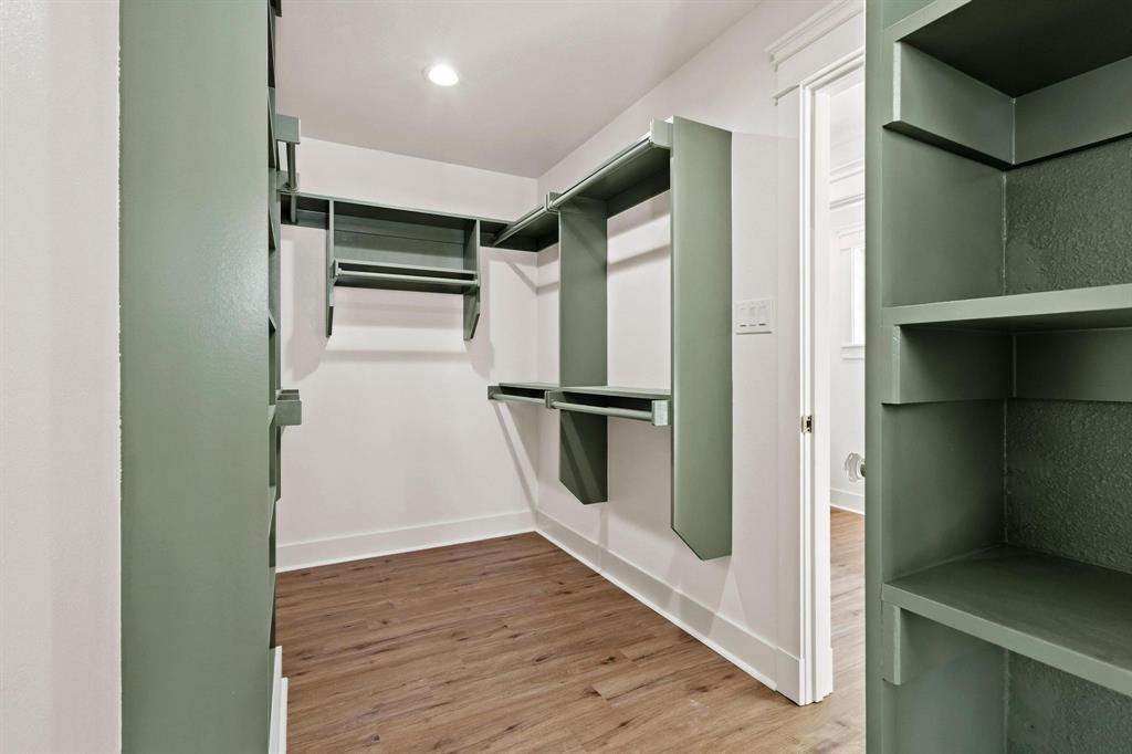 331 West Grand Street Whitewright, TX 75491 - Photo 25 of 39 a view of a refrigerator in kitchen and an empty room