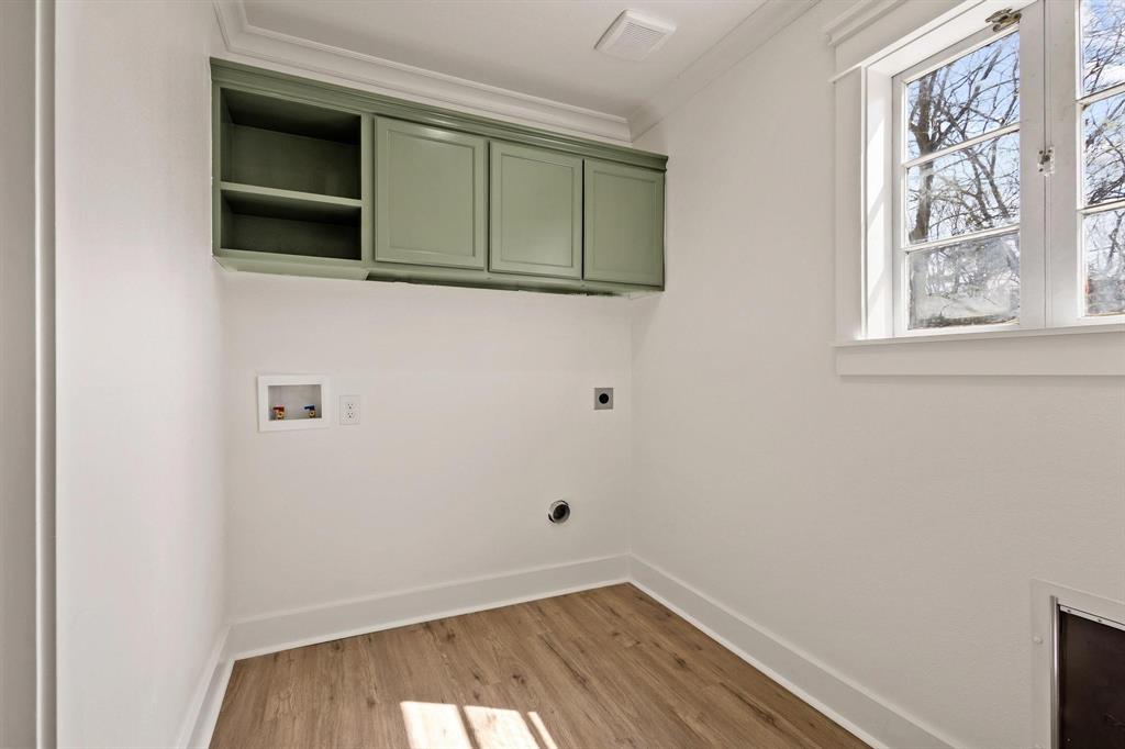 331 West Grand Street Whitewright, TX 75491 - Photo 26 of 39 a view of a small space with wooden floor and a window