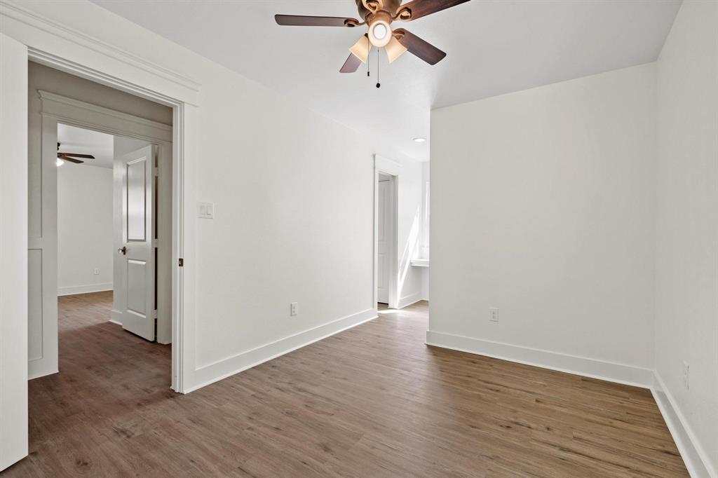 331 West Grand Street Whitewright, TX 75491 - Photo 27 of 39 a view of an empty room with wooden floor