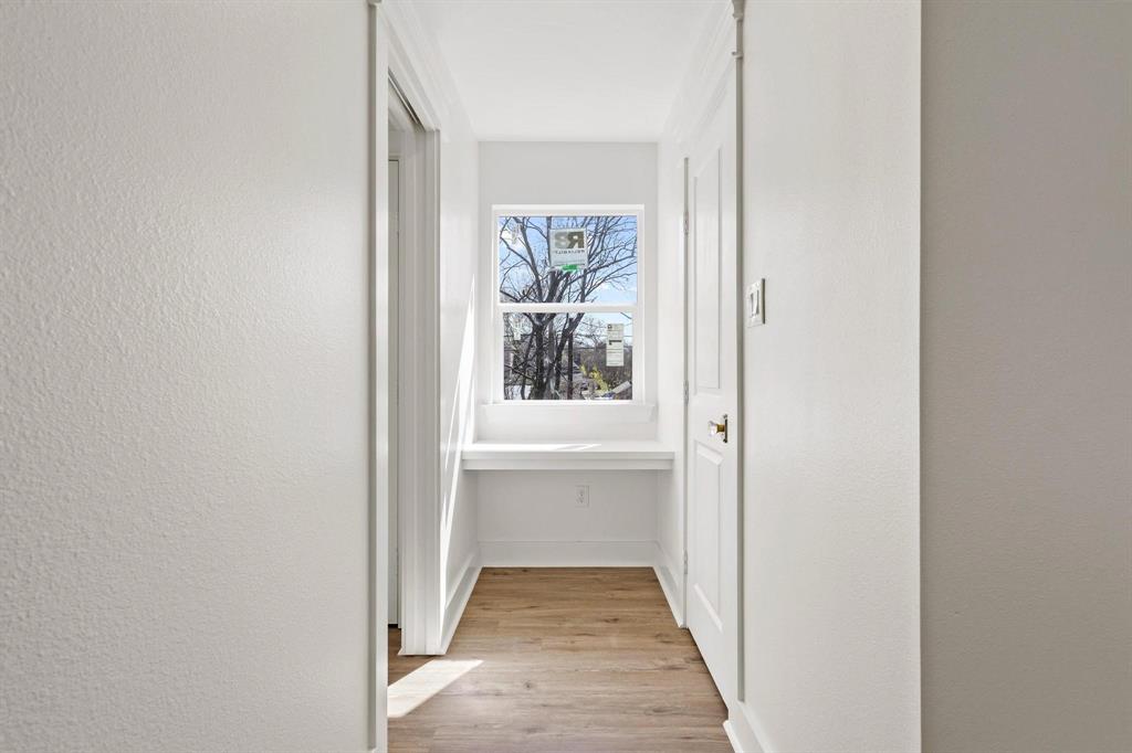 331 West Grand Street Whitewright, TX 75491 - Photo 29 of 39 a view of a hallway with wooden floor and a window