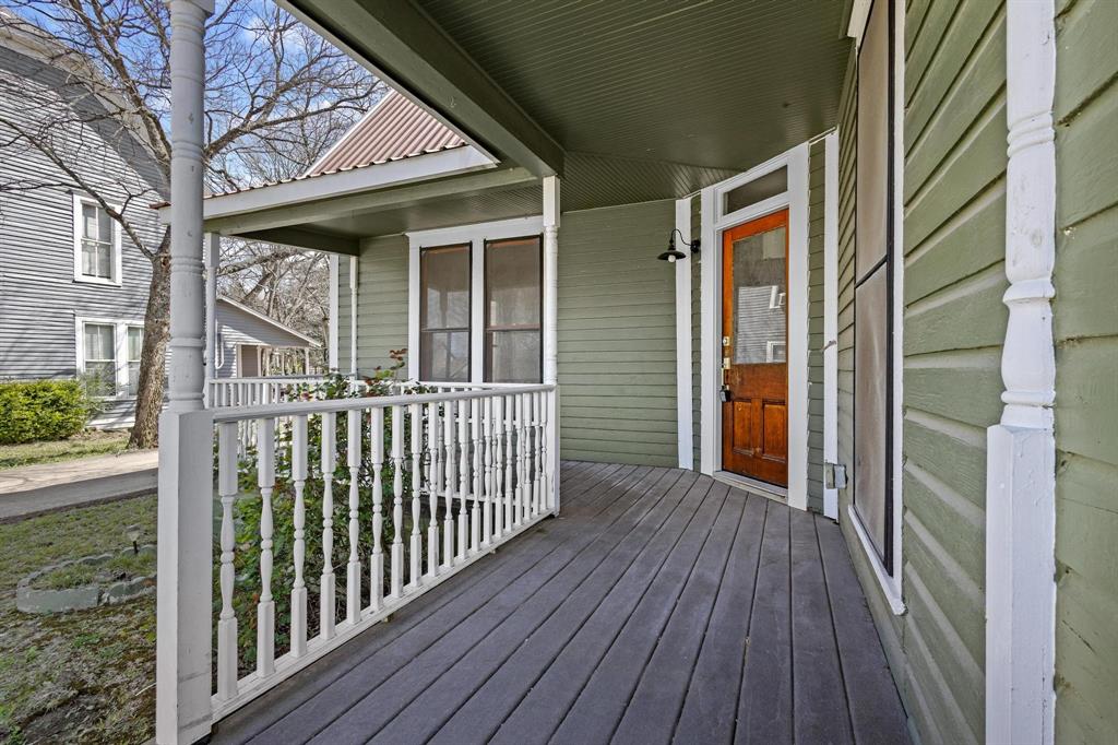331 West Grand Street Whitewright, TX 75491 - Photo 3 of 39 a view of a porch with wooden floor
