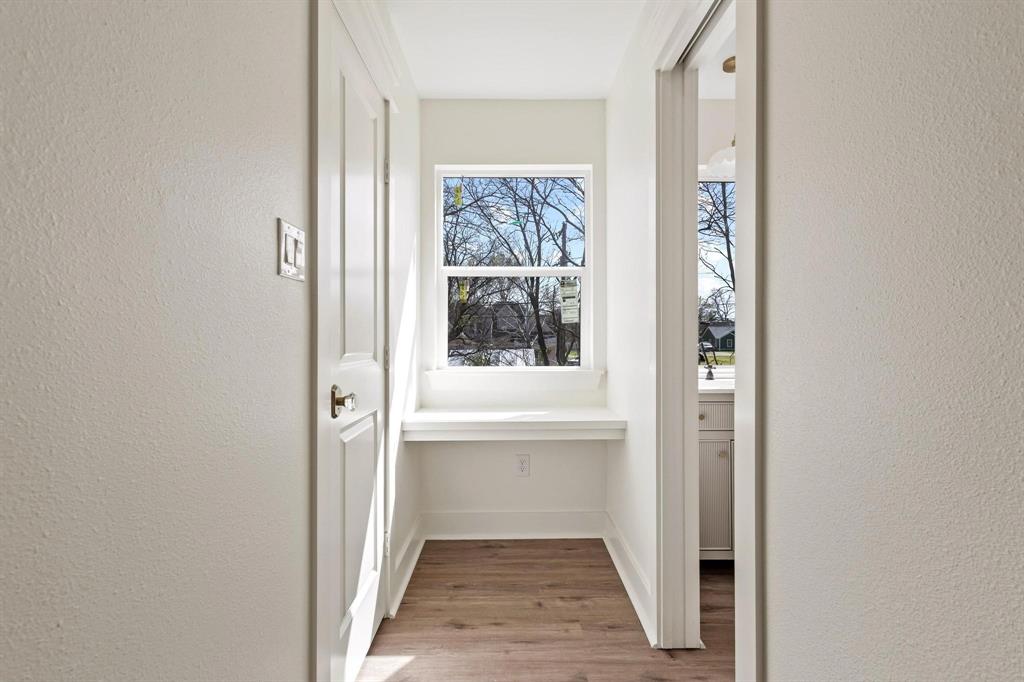 331 West Grand Street Whitewright, TX 75491 - Photo 34 of 39 a view of a hallway with bathroom and hallway