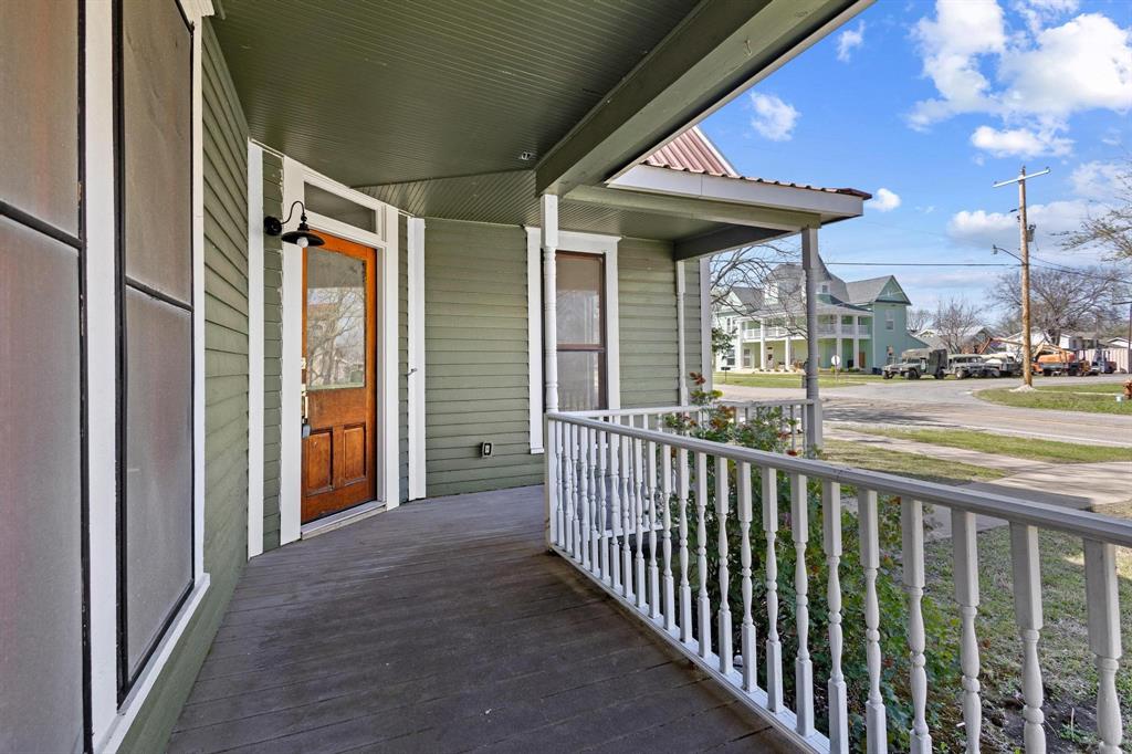 331 West Grand Street Whitewright, TX 75491 - Photo 4 of 39 a view of a porch with furniture and backyard