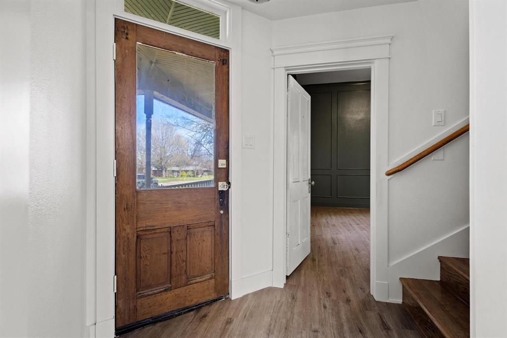 331 West Grand Street Whitewright, TX 75491 - Photo 5 of 39 a view of a hallway with wooden floor