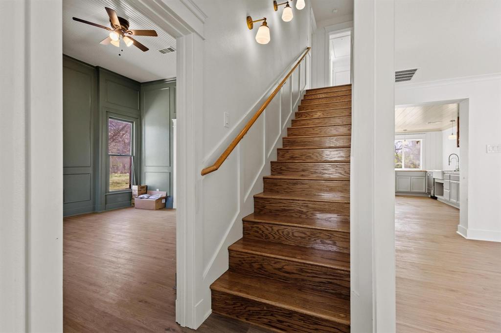 331 West Grand Street Whitewright, TX 75491 - Photo 6 of 39 a view of a hallway with wooden floor and entryway