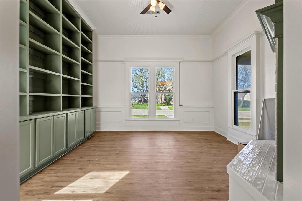 331 West Grand Street Whitewright, TX 75491 - Photo 10 of 39 a view of an empty room with kitchen and window