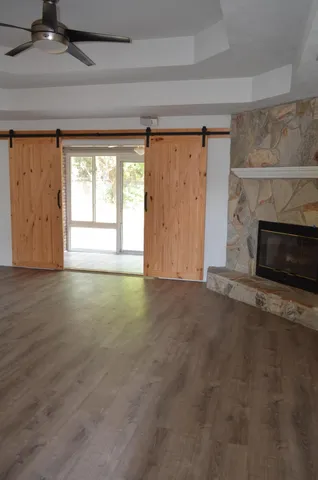 a view of room with wooden floor