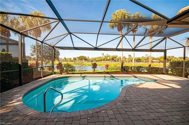 a view of a swimming pool with a lounge chairs