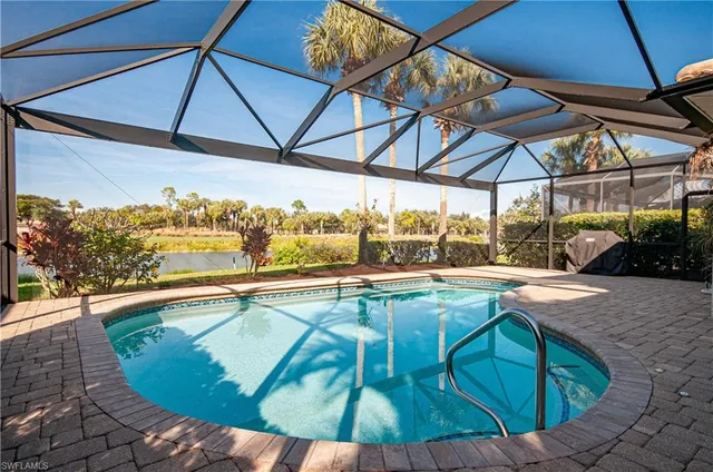 a view of a swimming pool with a porch