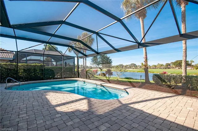 a view of a swimming pool with a porch